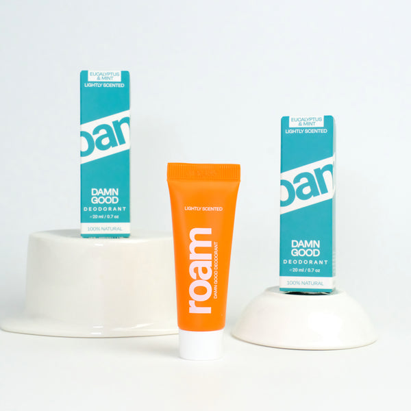 Three tubes of roam deodorant on a white background